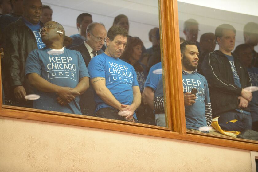Supporters of the ride-hailing service Uber observed Wednesday’s Chicago City Council meeting from the balcony. | Brian Jackson/ For the Sun-Times