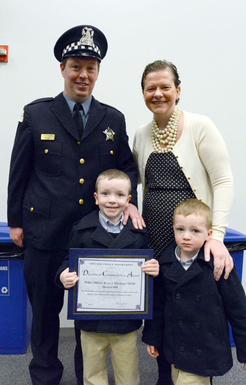 <small><strong> Chicago Police Officer Ryan Sheahan, his wife, Anne, and their two children, Tommy, 5, and Mick, 3, at the Chicago Police Department Commendation Ceremony at the Public Safety Building, 3510 S. Michigan. Tuesday, January 20, 2015 | Brian J