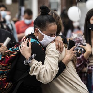 People gather for a vigil for 13-year-old Adam Toledo near the location of the shooting at West 24th Street and South Sawyer Avenue in Little Village, Monday afternoon, April 5, 2021. Toledo was fatally shot in the chest by a Chicago police officer in an alley west of the 2300 block of South Sawyer Avenue near Farragut Career Academy High School.