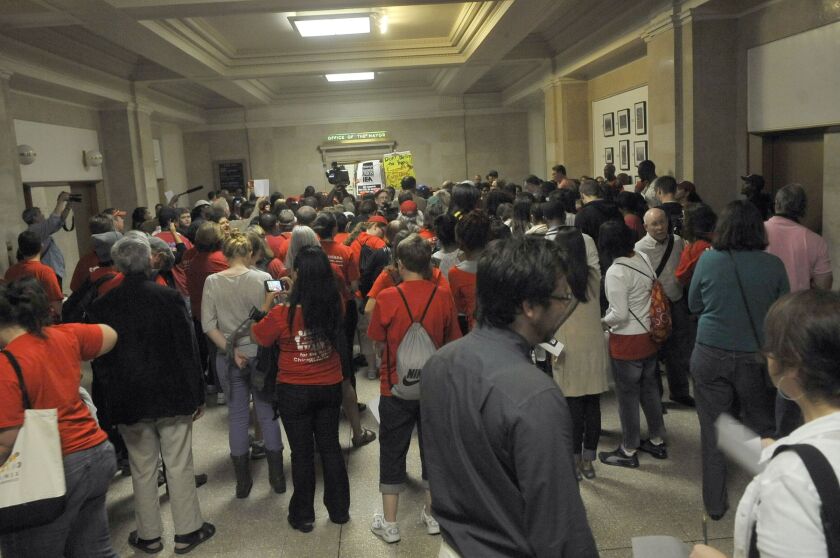Teachers and their supporters protested outside Mayor Rahm Emanuel’s office in September 2012 after the mayor went to court, trying to get a judge to order teachers to end their strike and go back to work.