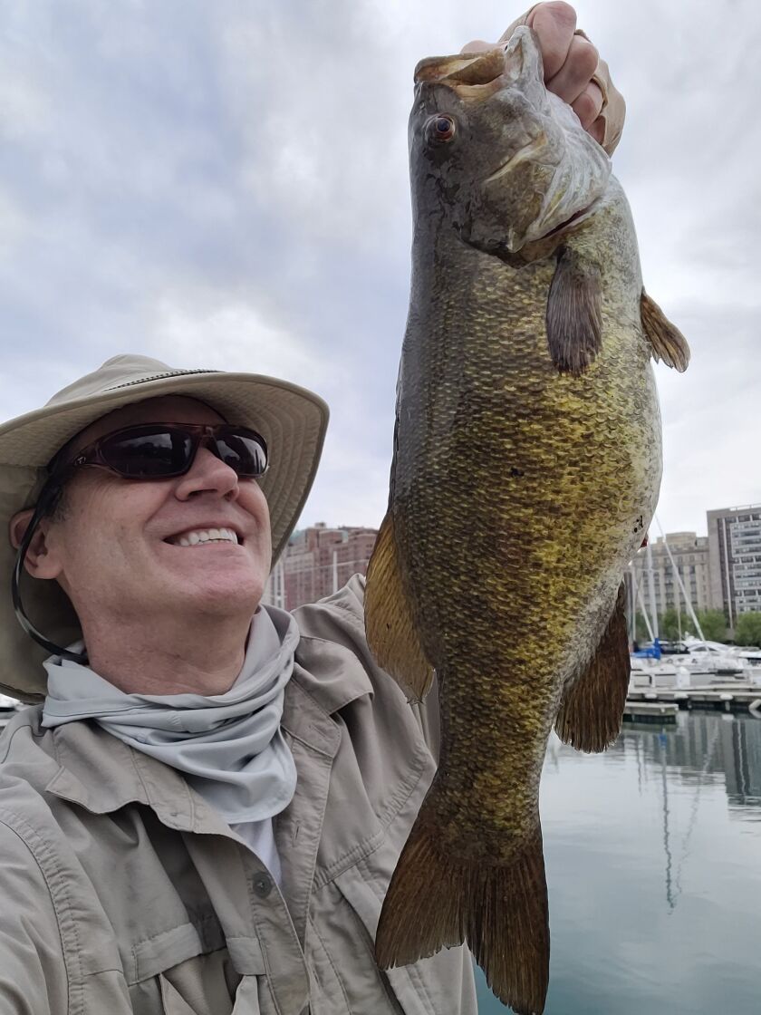 Laurance Reed with a good smallmouth bass from the Chicago lakefront. Provided photo