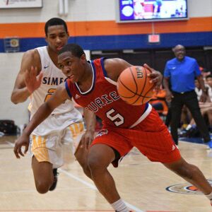 Curie’s Trevon Hamilton (5) makes a move to the basket be defended by Simeon’s Jaylen Granger (24), Saturday 12-29-18. Worsom Robinson/For Sun-Times