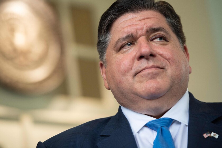 Close headshot looks upward at Gov. JB Pritzker from just below his neck.