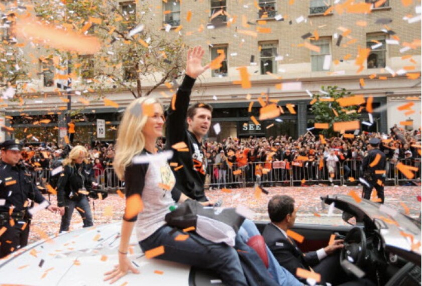 <em>Buster Posey waves to the crowd during the Giants’ 2012 parade. It was their second of three parades in five years — without so much as making the playoffs between championships.</em>