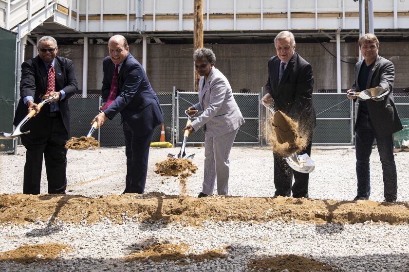Shoveling ceremoniously on Wednesday, June 2, near the Bryn Mawr station on the CTA’s Red Line are (from left) CTA President Dorval Carter, Ald. Harry Osterman (48th), Mayor Lori Lightfoot, U.S. Sen. Dick Durbin and U.S. Rep. Mike Quigley. They were there to celebrate ongoing work to replace four stations and the century-old tracks connecting them.