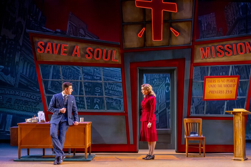 Pepe Nufrio and Erica Stephan stand on stage in 'Guys and Dolls.'