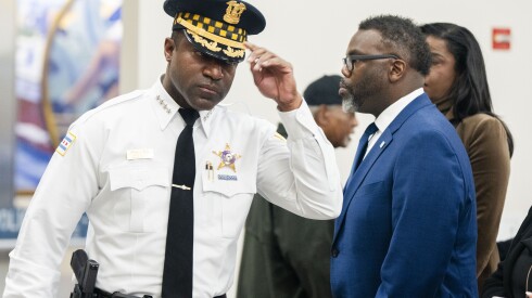 Chicago police Supt. Larry Snelling walks past Chicago Mayor Brandon Johnson before a press conference at the Chicago Police Headquarters, Tuesday, Oct. 31, 2023.