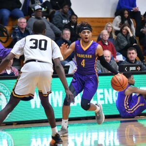Waukegan’s Andre White (4) shakes off Marian Catholic’s Breion Hill. Worsom Robinson/For the Sun-Times.
