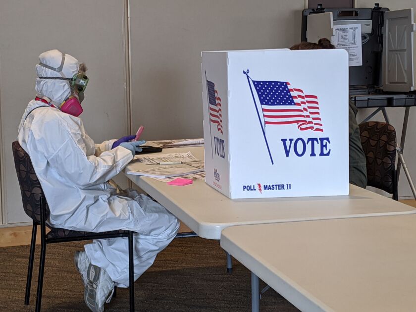 Elections Chief Inspector Mary Magdalen Moser runs a polling location in Kenosha, Wisconsin, in full hazmat gear.