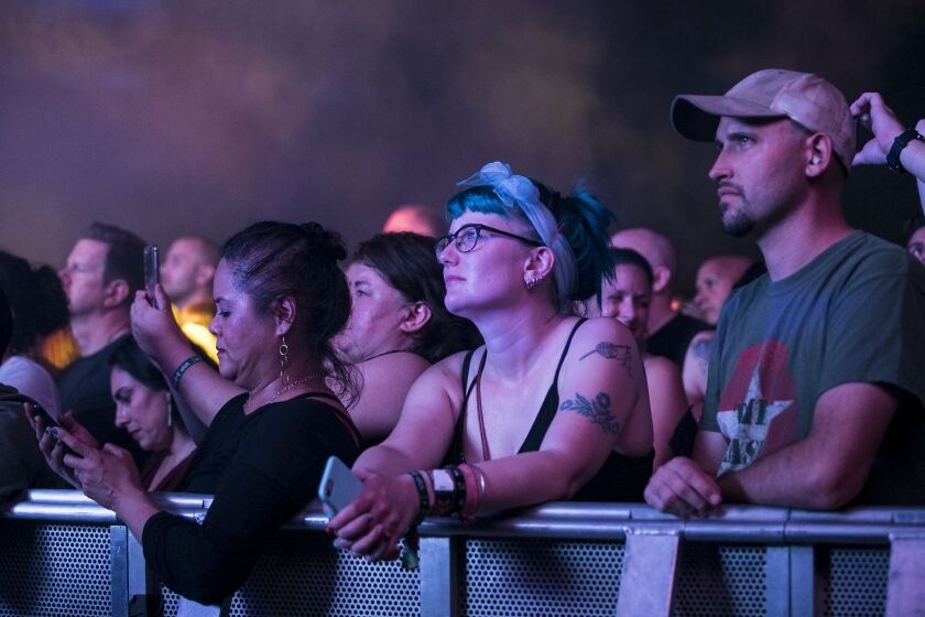 Fans listen to New Order perform on day one of Riot Fest in Douglas Park. | Ashlee Rezin/Sun-Times