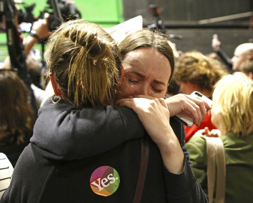 People from the”Yes” campaign react as the results of the votes begin to come in, after the Irish referendum on the 8th Amendment of the Irish Constitution at the RDS count centre, in Dublin, Ireland, Saturday May 26, 2018. A leading anti-abortion group s