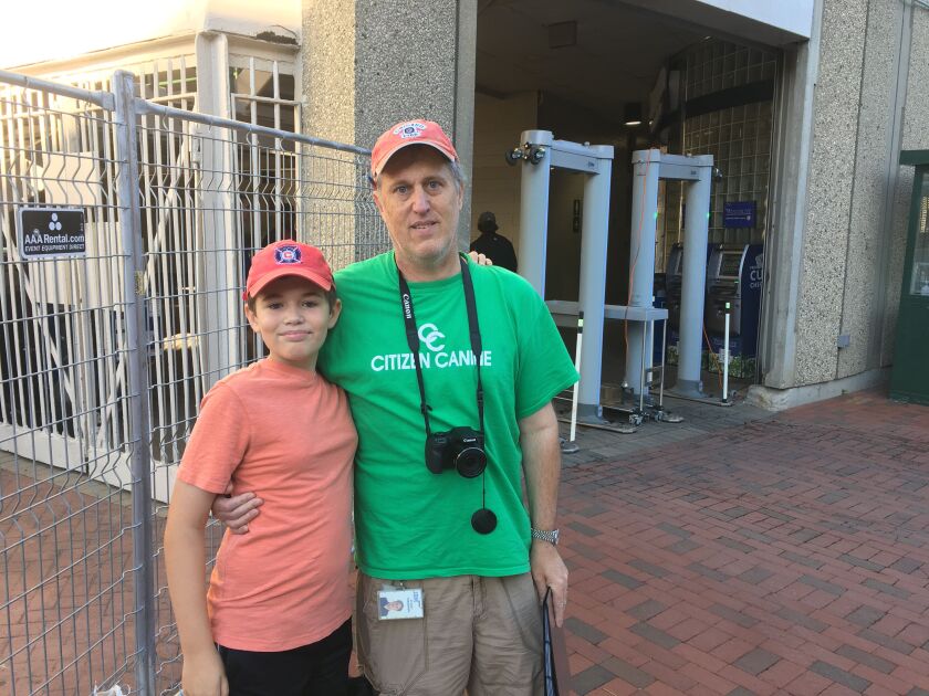 Alexander Torzewski, 11, with dad Stuart Torzewski, 51, outside<br>Wrigley Monday morning. | Mitch Dudek/Sun-Times