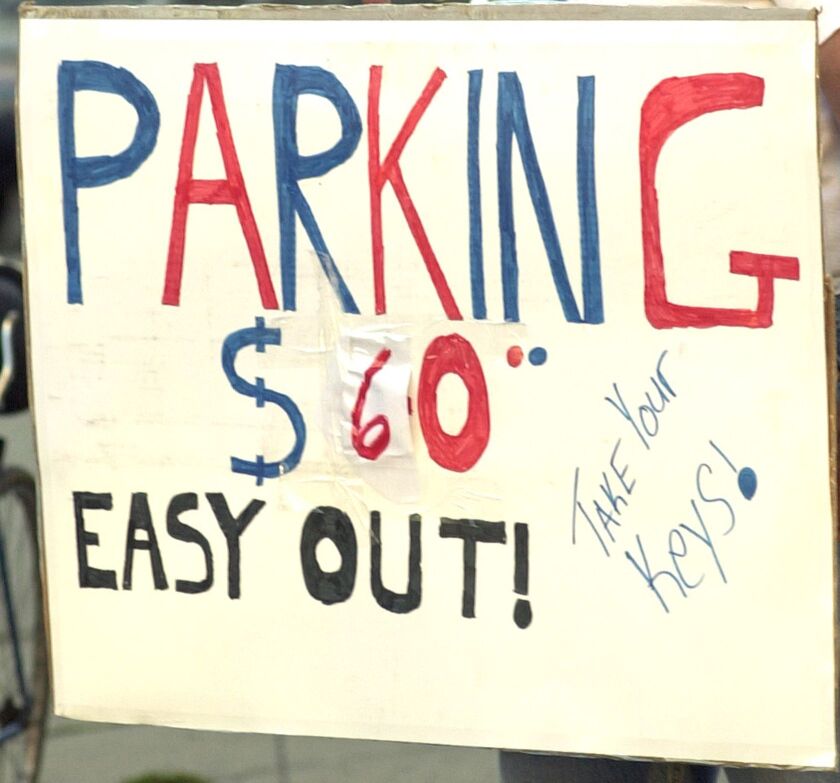 A sign advertising off-street parking for a Chicago Cubs game at Wrigley Field.