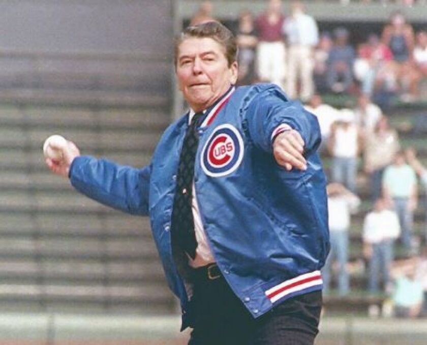 President Ronald Reagan throws out a ceremonial first pitch Sept. 30, 1988, at Wrigley Field before a Pirates-Cubs game. Charles Tasnadi/AP
