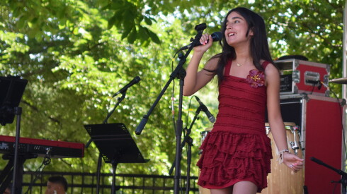 Charlisse Gomez sings at Barrio Arts Fest