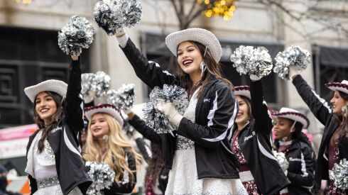 Heights High School from Houston students wave to the crowd on State Street during Thursday’s annual Thanksgiving Day parade in the Loop, Thursday, Nov. 24, 2022. | Pat Nabong/Sun-Times