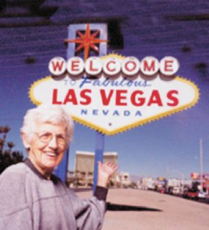 Betty Willis and the sign she designed. | FILE PHOTO