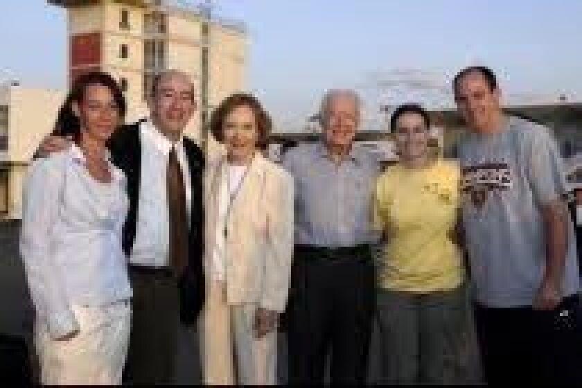 Rosalynn and Jimmy Cater (center) with (from left) Aimee and Rick Jasculca, Lauren Foley and Andrew Jasculca in Ethiopia in an undated photo.