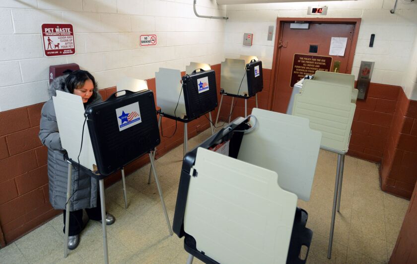 7th ward Alderman Natashia Holmes, votes in today February 2015.