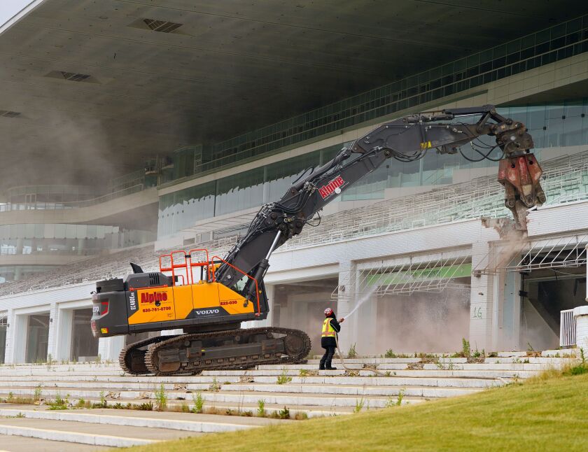 An excavator begins to demolish the Arlington Park grandstands, Friday, June 16, 2023. 