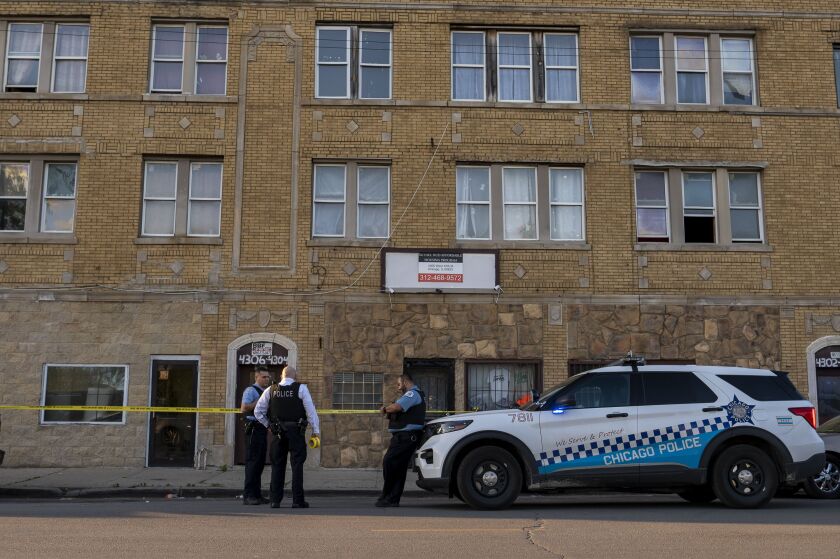 Chicago police work a crime scene in the 4300 block of West 17th Street which is related to a nearby scene where an 8-year-old boy was shot in the knee while playing outside near 18th and Kildare, in the Lawndale neighborhood, Thursday, May 13, 2021.