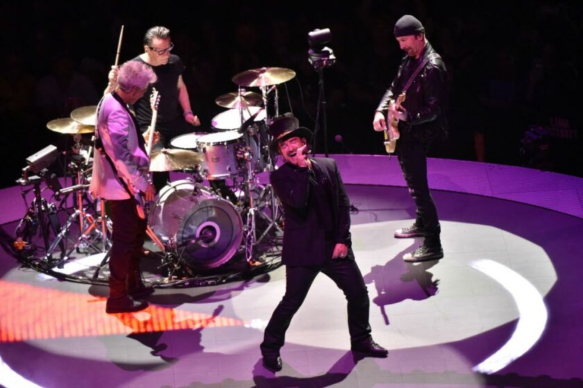 Bono (clockwise from front), Adam Clayton Larry Mullen Jr. and The Edge of U2 perform during the “Experience + Innocence” tour at the United Center on Tuesday, May 22, 2018, in Chicago. | Photo by Rob Grabowski/Invision/AP