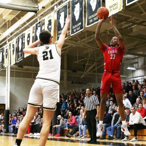 Curie’s Ramean Hinton hits a three against Oak Forest.
