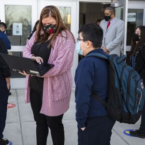 Middle school students check in with CPS Staff at Richardson Middle School at 6018 S Karlov Ave in West Lawn, Monday, March 8, 2021.