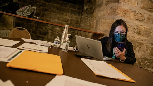Yessenia Cervantes-Vázquez, a lead community health worker with Rush Community Health Center, helps residents apply for the Chicago Resilient Communities Pilot in the basement of St. Paul’s Catholic Church in the Pilsen neighborhood in 2022.
