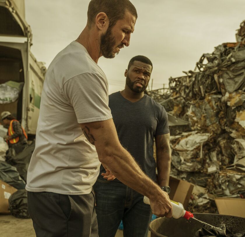 Pablo Schreiber (left) and Curtis “50 Cent” Jackson play lawbreakers in “Den of Thieves.” | STXfilm
