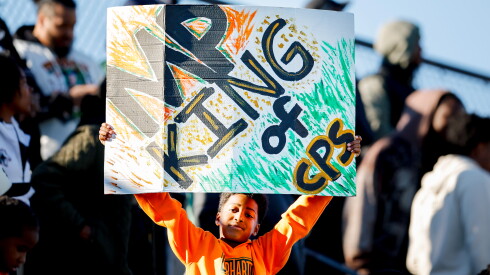A Morgan Park fan holds up a sign during the Public League championship game against Kenwood at Lane Stadium.