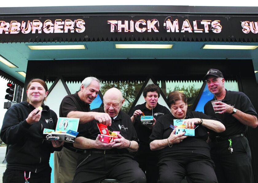Superdawg founders Maurie and Flaurie Berman (center front) and their family outside the Northwest Side drive-in restaurant. | Sun-Times files
