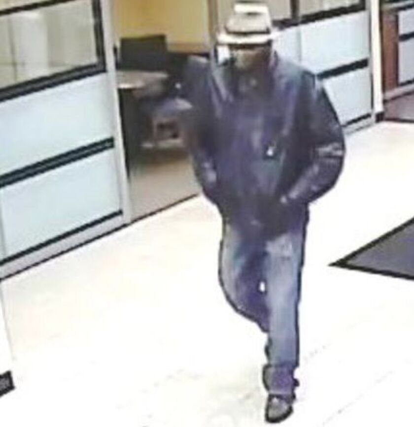 Surveillance photo of a man suspected of robbing three Chase Bank branches on the North Side. | FBI