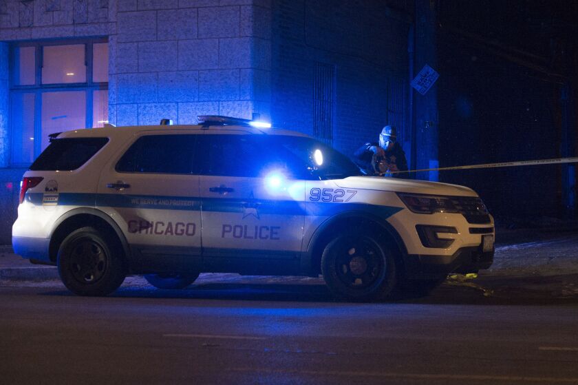 Officers responding to a shooting Wednesday morning in the West Side Austin neighborhood that left a 21-year-old man wounded. | Tyler Lariviere/Sun-Times