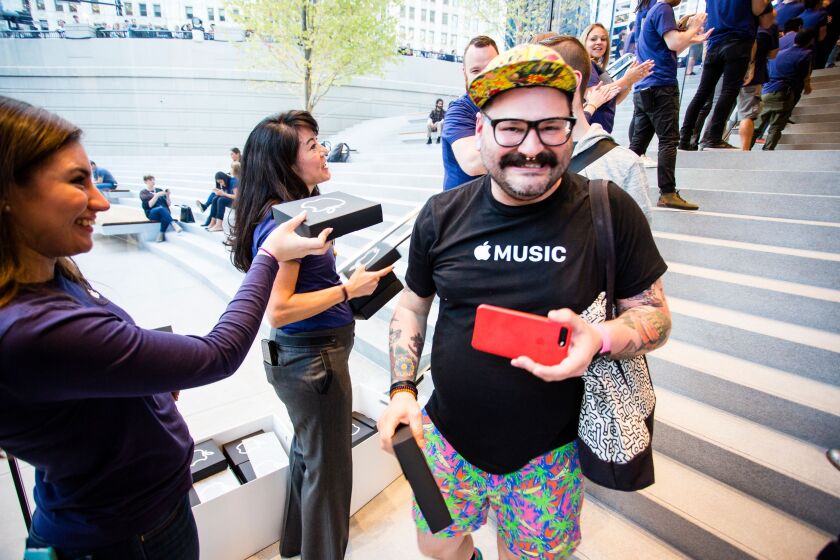 Customers received complimentary T-shirts at the opening of the new Apple Store. | James Foster/For the Sun-Times