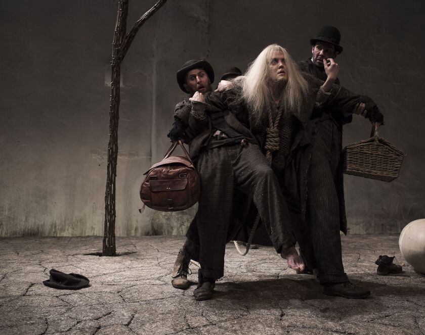 Aaron Monaghan as Estragon, Garrett Lombard as Lucky, and Marty Rea as Vladimir in Druid Theatre’s “Waiting for Godot” at Chicago Shakespeare’s Courtyard Theater. | Matthew Thompson