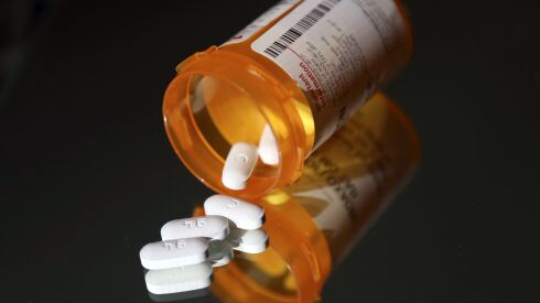 A pill bottle with prescription drugs is shown in this file photo from 2019. In Illinois, thousands of seniors pay $2,000 a year for prescription drugs.