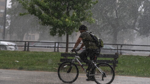 A biker rides on the Lakefront Trail near 57th Street Beach on the South Side on Saturday.