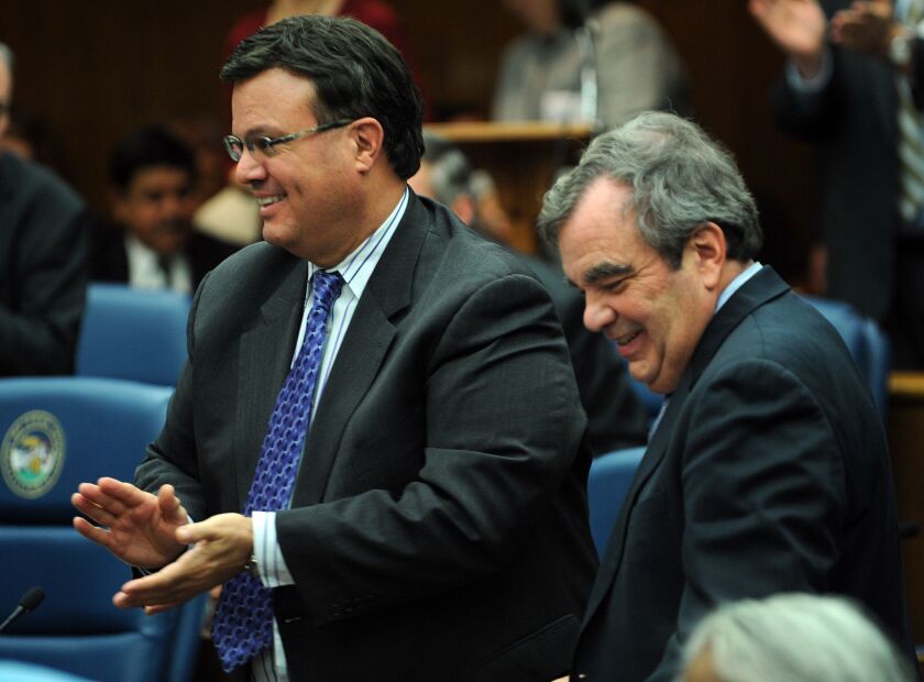 Cook County Board Commissioner Peter Silvestri, left, and Finance Committee Chairman John Daley in 2011.