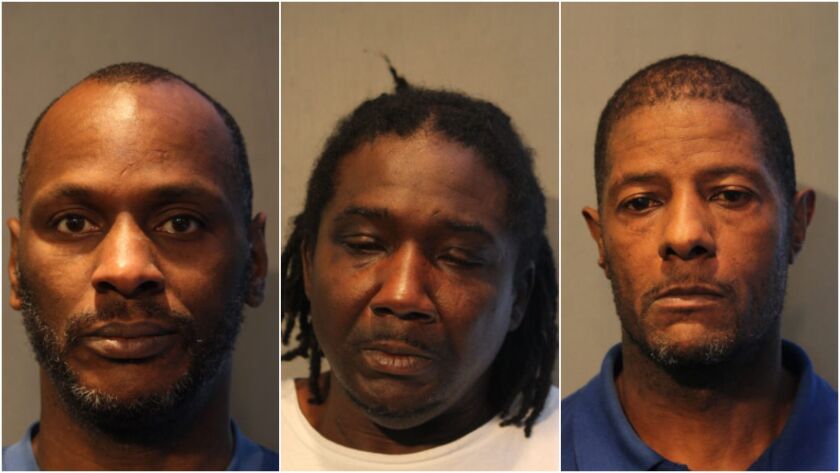 Three men are accused of holding employees of a store hostage during an attempted robbery.