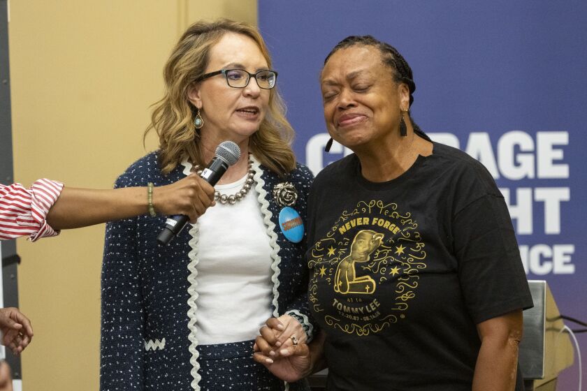 Former U.S. Gabby Giffords, left, sings happy birthday to Marsha Lee, during a training seminar for gun violence survivors at the Hyatt Conference Center at McCormick Place, Sept. 19, 2023.