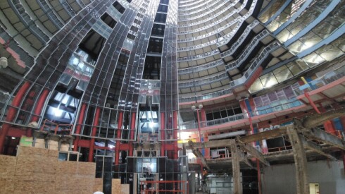 Judy Chicago standing on the Thompson Center's atrium floor.