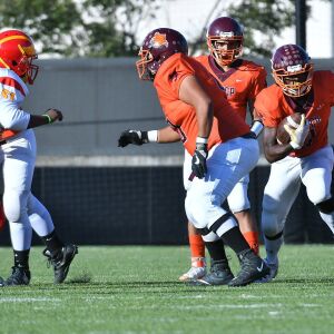 Carl McNickles (3) of Back of the Yards gets behind his linemen. Worsom Robinson/For the Sun-Times.