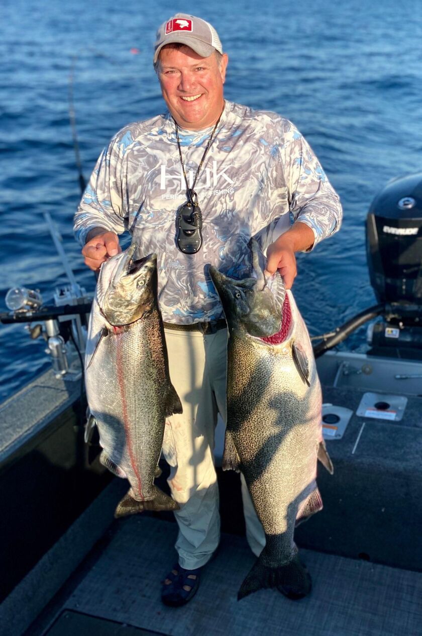 Brad Reineking gives a comparison between a 22-pound and a 35-pound-plus Chinook. Photo provided