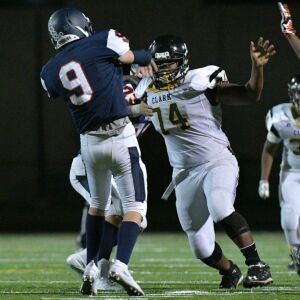 Clark’s Nathaniel Nesbitt (74) rushes the quarterback. Worsom Robinson/For the Sun-Times.