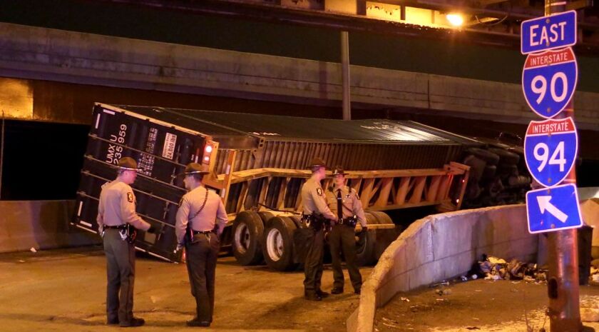 Illinois State Police responding to a rollover crash early Thursday on an entrance ramp to the Dan Ryan Expressway in Pilsen. | Justin Jackson/Sun-Times