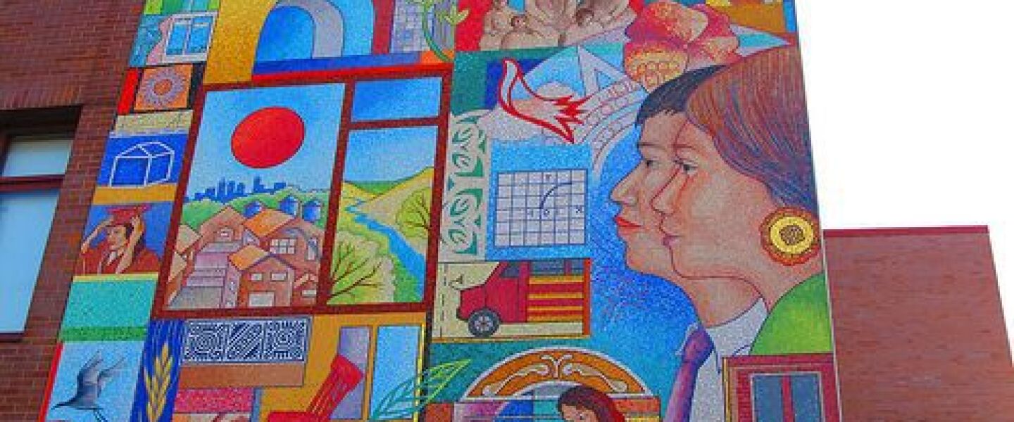 A mosaic at Cristo Rey Jesuit High School depicts Our Lady of Guadalupe in the top corner and images of students and symbols of the school’s mission.