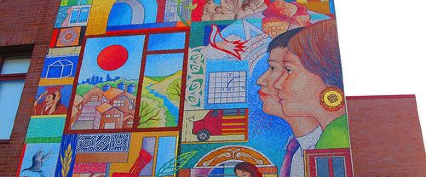 A mosaic from Cristo Rey Jesuit High School depicts Our Lady of Guadalupe in the upper corner along with images of students and symbols of the school's mission.