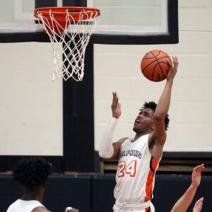 Whitney Young’s Tyler Beard (24) scores against York during their 58-56 win in Hillside, Wednesday, March 6, 2019. | Kevin Tanaka/For the Sun Times
