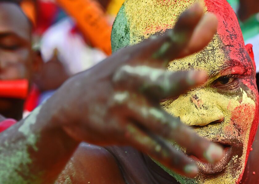 A Malian supporter cheers his team ahead of the 2015 African Cup of Nations group D football match between Guinea and Mali in Mongomo, on January 28, 2015. CARL DE SOUZA/AFP/Getty Images